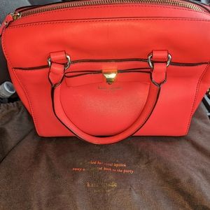 New Kate Spade Coral Purse. New. Authentic. Zipper closure. Crossbody strap incl